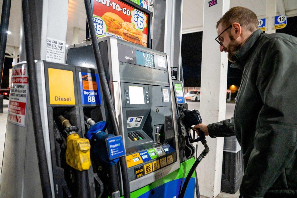 A man prepares to pump gas at a gas station in Elkridge, Md., on Nov. 12, 2025. (Madalina Kilroy/The Epoch Times)