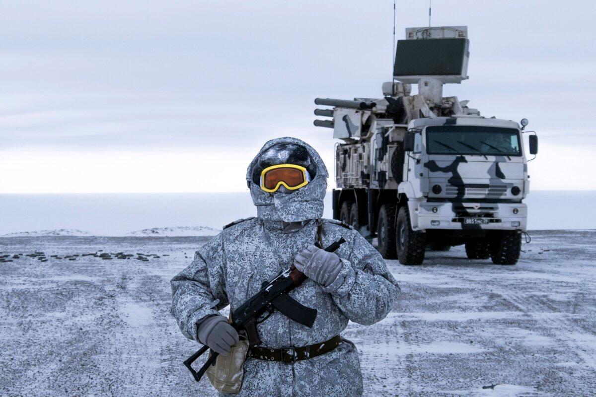A Russian solder stands guard as on the Kotelny Island, part of the New Siberian Islands archipelago located between the Laptev Sea and the East Siberian Sea, Russia, on April 3, 2019. (AP Photo/Vladimir Isachenkov)