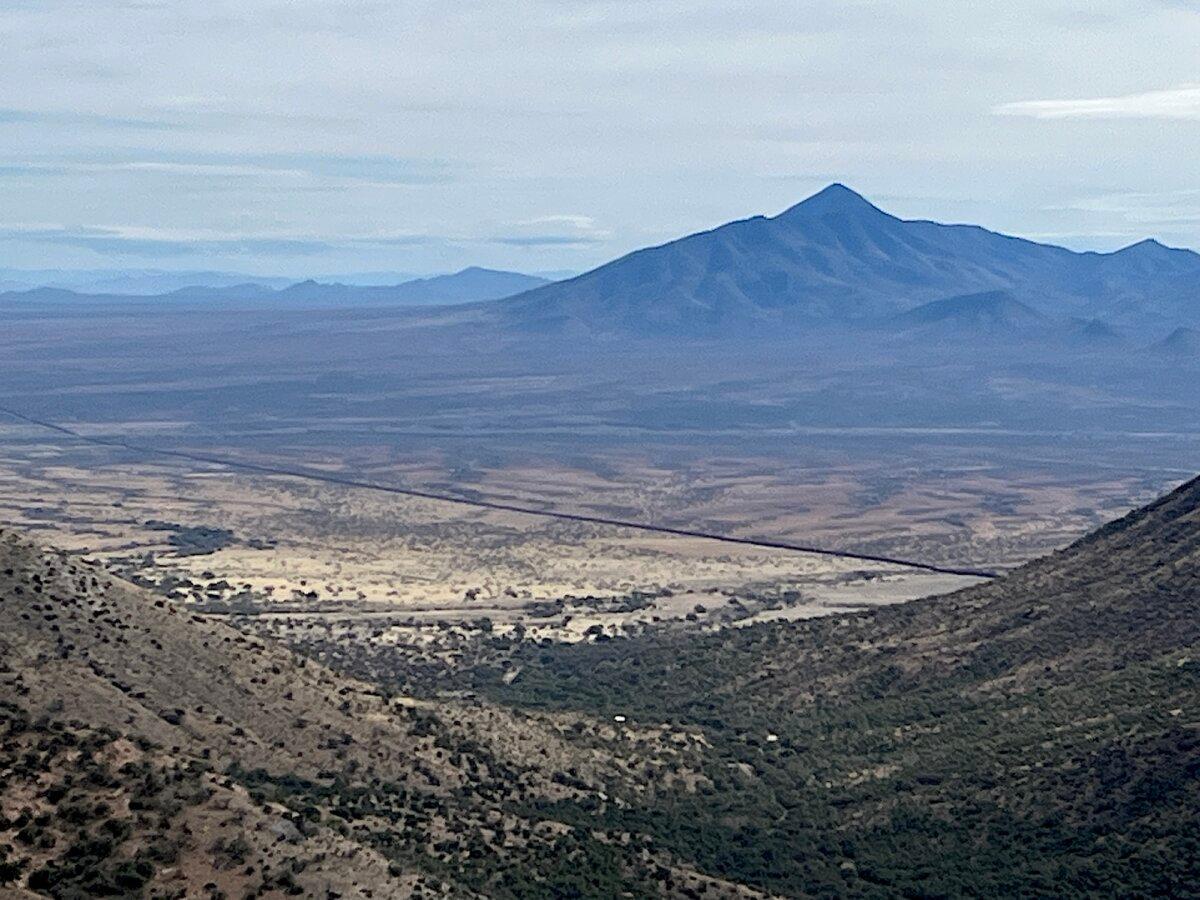 A view of the U.S.–Mexico border fence in southern Arizona from a high vantage point at the Coronado National Memorial area on Jan. 22, 2026. (Allan Stein/The Epoch Times)