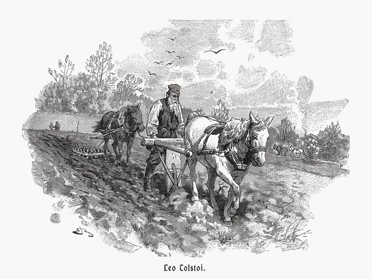 Wood engraving of Leo Tolstoy plowing, published in 1900. (ZU_09/Getty Images)