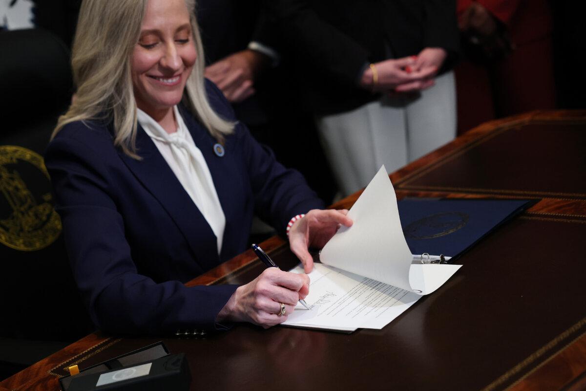 Virginia Gov. Abigail Spanberger signs executive orders after being sworn into office at the Virginia State Capitol in Richmond, Va., on Jan. 17, 2026. (Win McNamee/Getty Images)