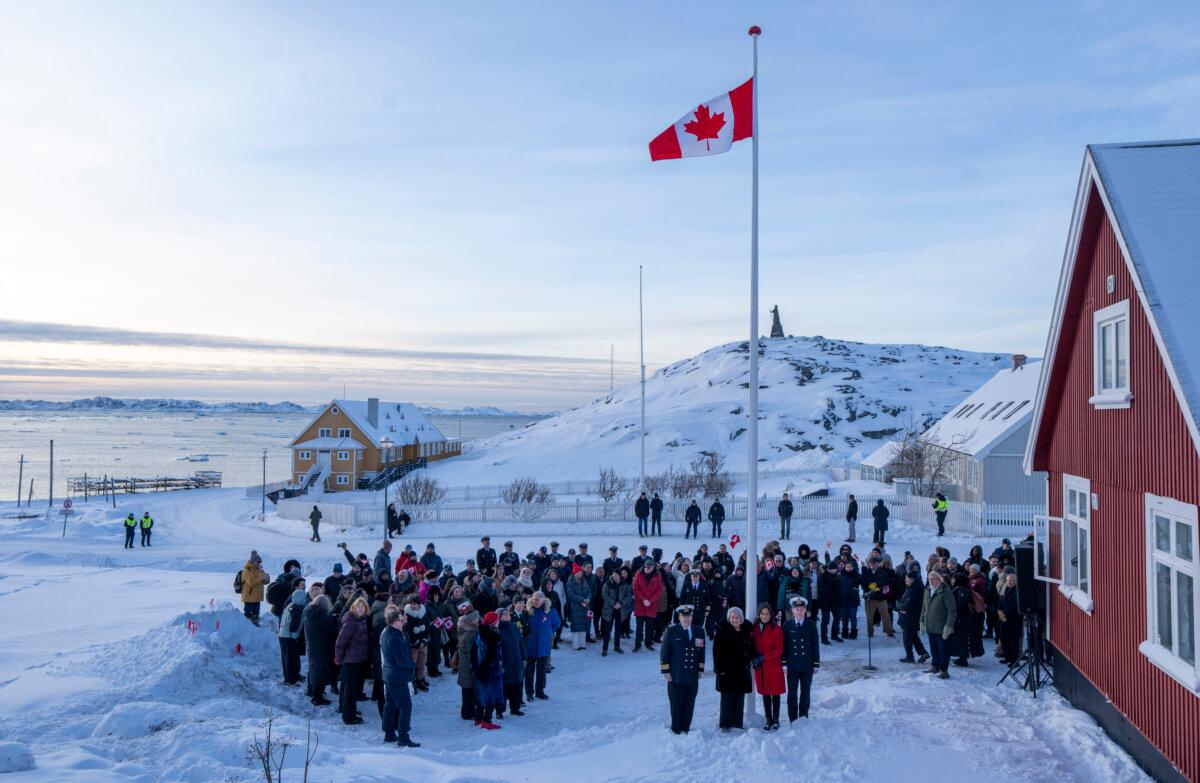 Governor General Mary Simon, second from front left, and Foreign Affairs Minister Anita Anand, second from front right, pose for photos following the raising of the Canadian flag at the new Canadian consulate in Nuuk, Greenland, on Feb. 6, 2026. (The Canadian Press/Christinne Muschi)