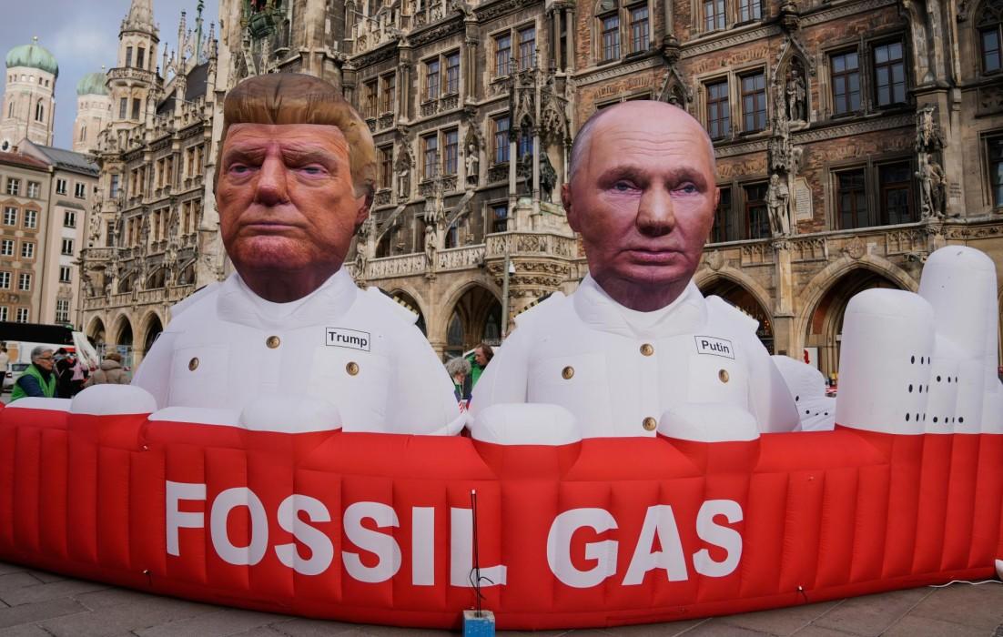 Figures depicting President Donald Trump and Russian President Vladimir Putin are displayed by Greenpeace activists at Marienplatz square in Munich, Germany, on Feb. 13, 2026. (Ebrahim Noroozi/AP)