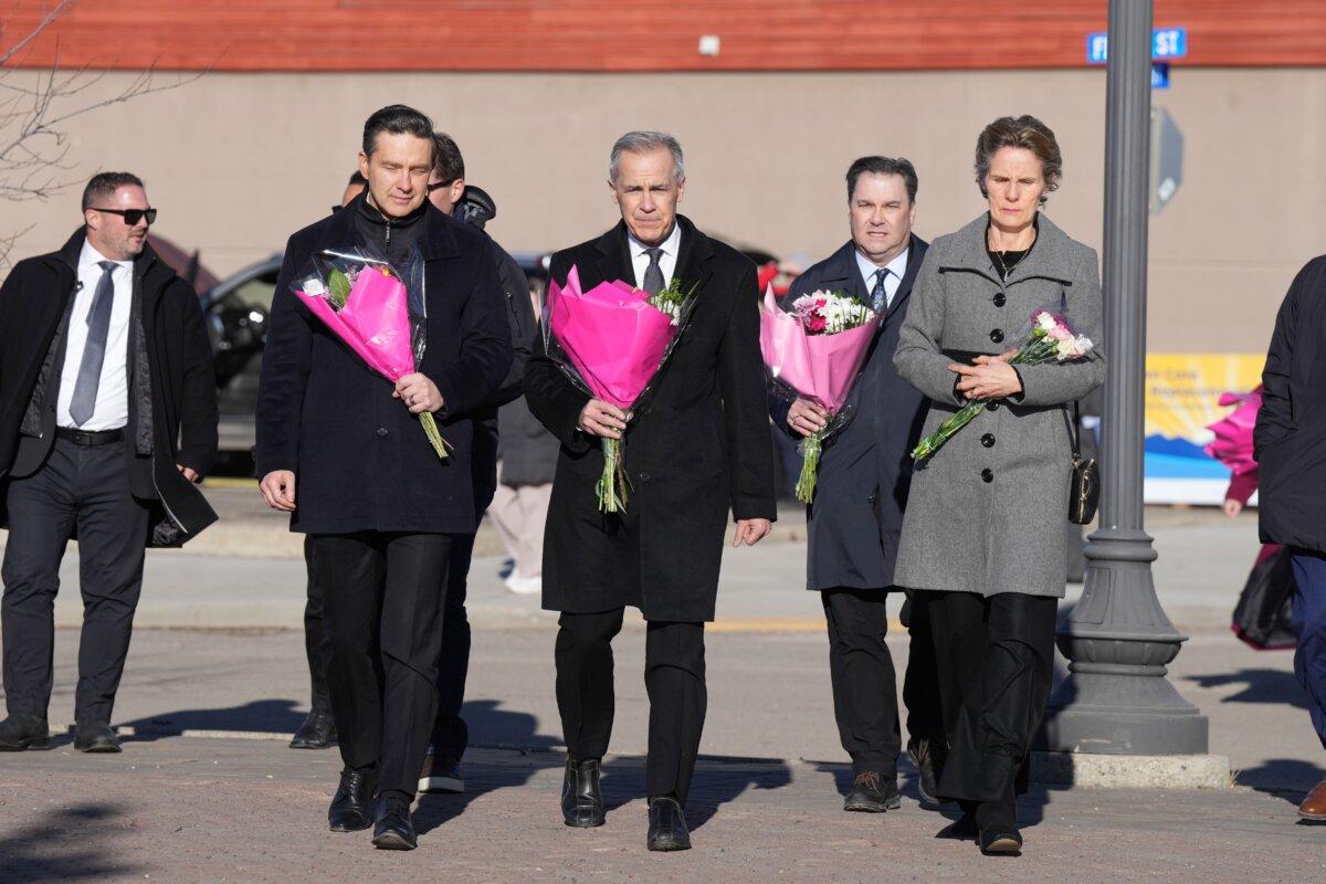 (2nd L–R) Conservative Leader Pierre Poilievre, Prime Minister Mark Carney, NDP Interim Leader Don Davies, and Carney's wife, Diana Fox Carney, arrive at a memorial for the victims of the Tumbler Ridge mass shooting, in Tumbler Ridge, B.C., on Feb. 13, 2026. (The Canadian Press/Christinne Muschi)