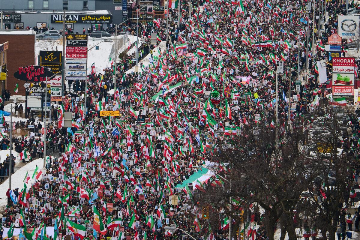 Iranian protesters march in support of regime change in Iran during a demonstration in Toronto on Feb. 14, 2026. (Sammy Kogan/The Canadian Press)
