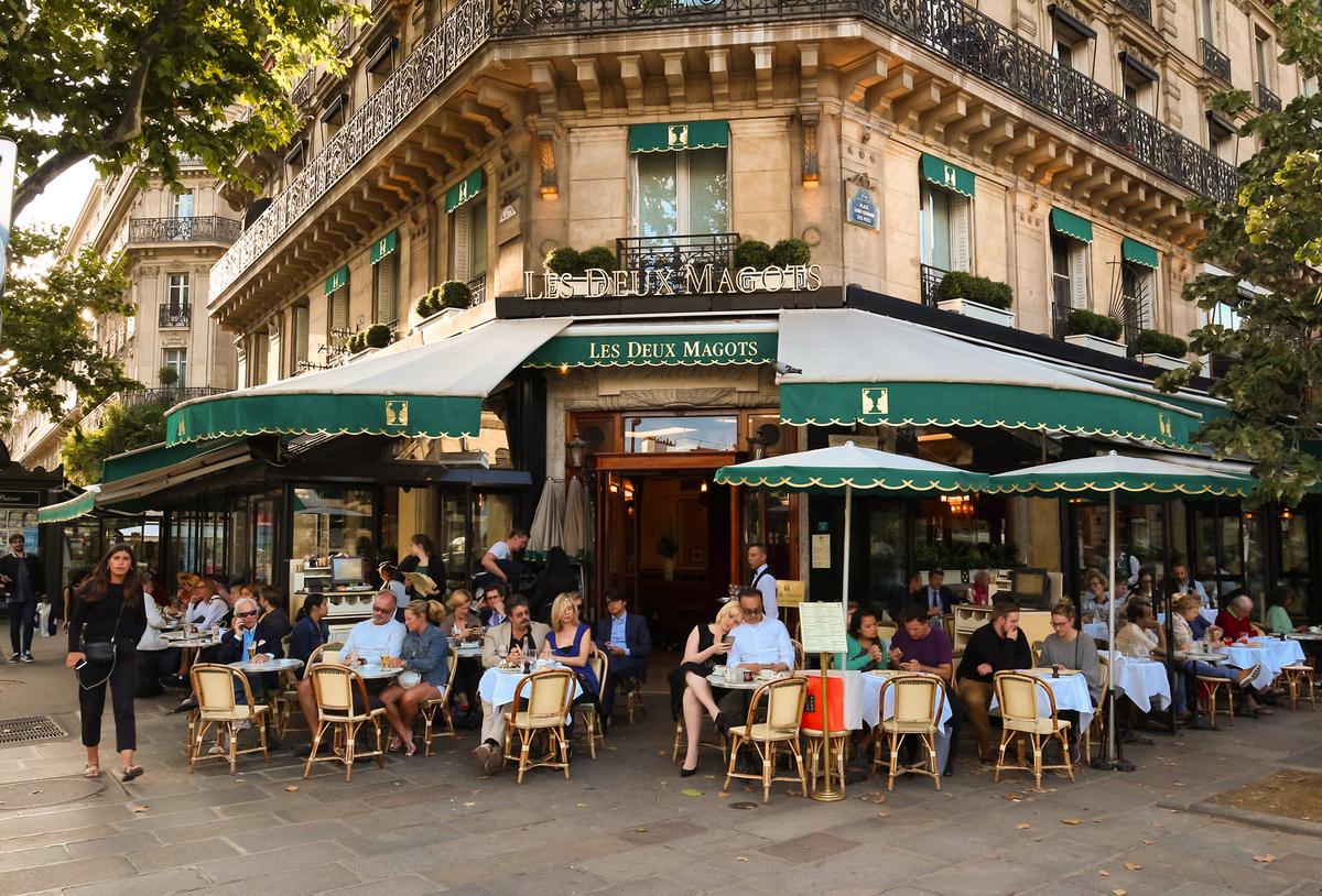 Cafes such as Les Deux Magots were social and literary hubs for expatriates such as Ernest Hemingway, who drew inspiration from Parisian street life. (Petr Kovalenkov/Shutterstock)