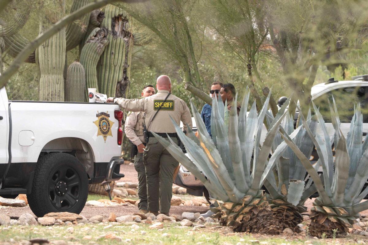 Pima County Sheriff’s Department deputies speak outside of Nancy Guthrie's home in Catalina Foothills Estates, Ariz., after her disappearance, on Feb. 12, 2026. (Rebecca Noble /Reuters)