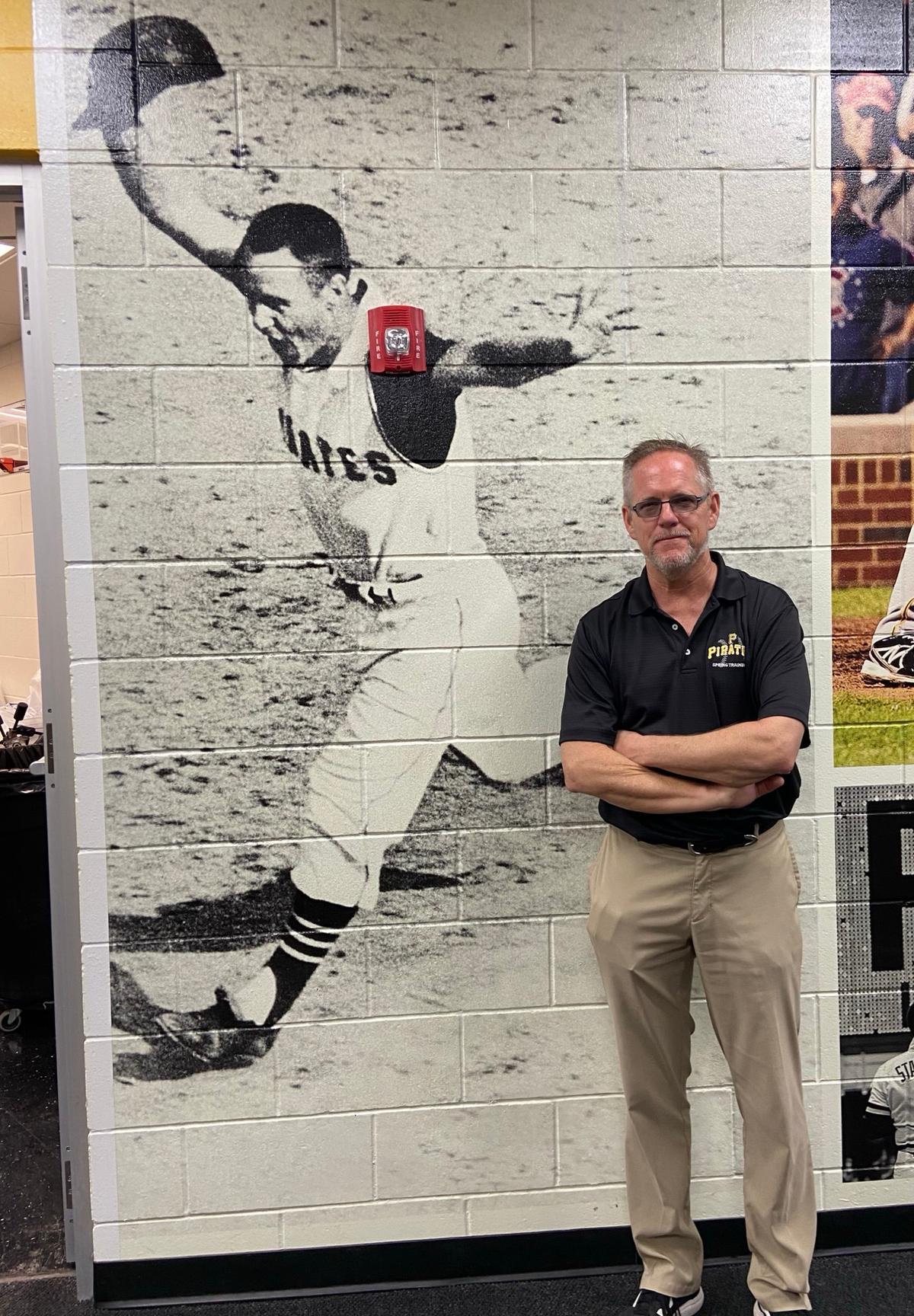Pirates’ team historian Jim Trdinich stands in front of a wall picture of Bill Mazeroski on Feb. 22, 2026. (Courtesy of Donald Laible)
