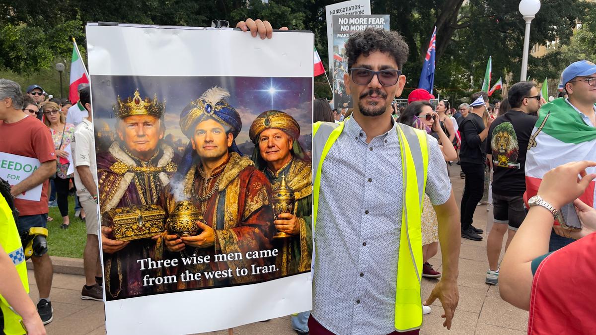 Iranian protestor holding a placard during a celebration after news of the death of Ayatollah Ali Khamenei, former leader of the Islamic Republic of Iran, taken in Sydney, Australia on March 1, 2026. (Adam Chiang/The Epoch Times)
