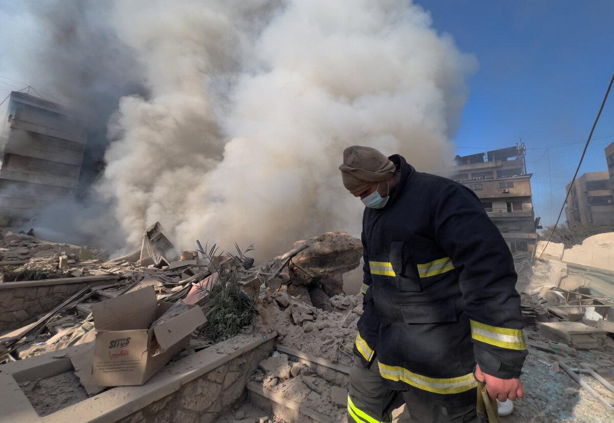 A rescue worker checks the site where several buildings were hit by Israeli airstrikes in Dahiyeh, a southern suburb of Beirut, Lebanon, on March 3, 2026. (Hussein Malla/AP)