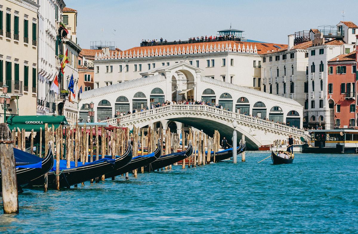 Completed in 1591, the Rialto Bridge is one of Venice's four main canal bridges. Its covered arcade is lined with small shops. (Mistervlad/Shutterstock)