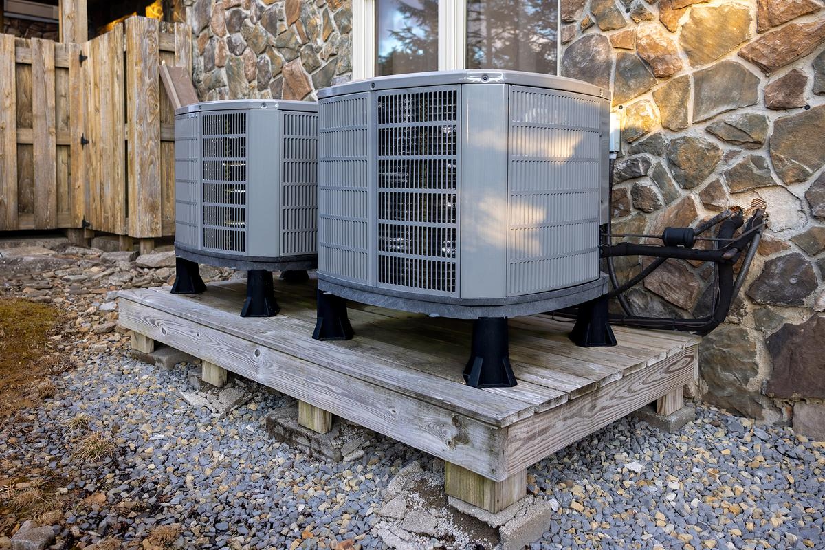 Maintaining clear airflow around HVAC systems improves efficiency and reduces wear on components. (Greggory DiSalvo/Getty Images)
