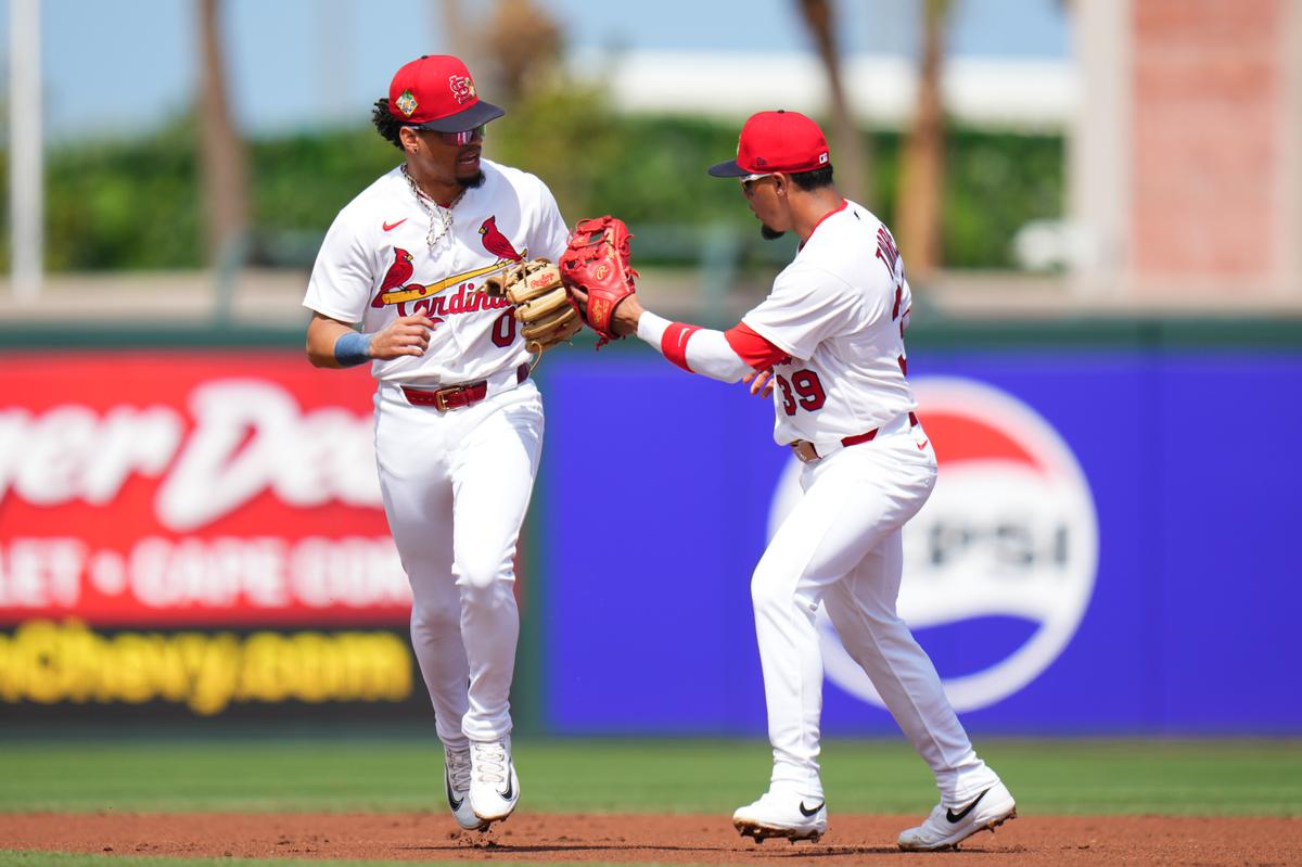 Masyn Winn #0 celebrates with Bryan Torres #39 of the St. Louis Cardinals after making an out against the Houston Astros during the first inning of a spring training game at Roger Dean Stadium in Jupiter, Florida, on Feb. 26, 2026. (Rich Storry/Getty Images)