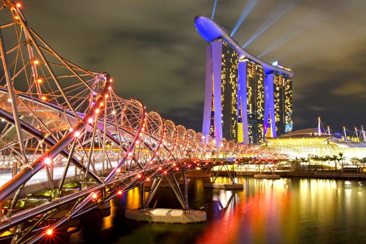 The Helix Bridge in Singapore is lit at night to show its spiral construction. (Ashwin Kharidehal/Dreamstime)