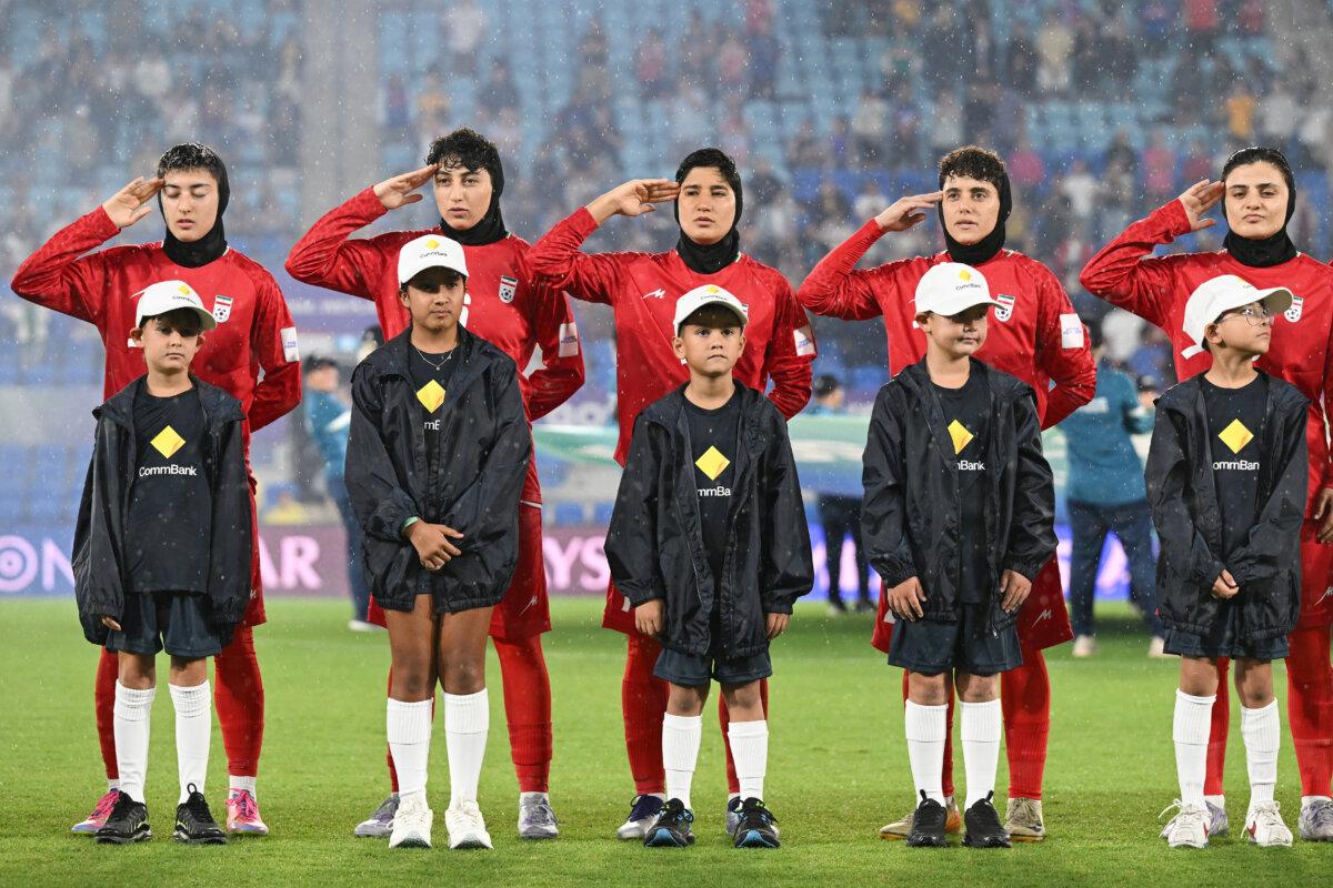 Iran players during their national anthem ahead of the Women's Asian Cup soccer match between Iran and the Philippines in Robina, Australia, on March 8, 2026. (Dave Hunt/AAP Image via AP)