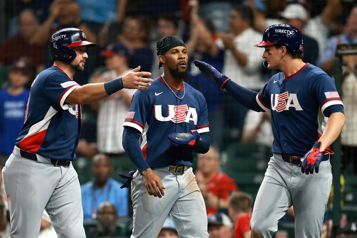 Cal Raleigh #29, Byron Buxton #25, and Roman Anthony #3 of the United States celebrate after scoring from an RBI double hit by Brice Turang #13 of the United States in the 5th inning against Brazil during the 2026 World Baseball Classic Pool B game between the United States and Brazil at Daikin Park in Houston, on March 6, 2026. (Kenneth Richmond/Getty Images)