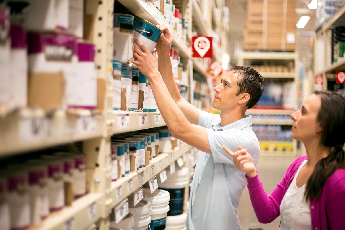Paint labels typically list coverage area, helping homeowners estimate how much paint they need before starting a project. (FatCamera/Getty Images)