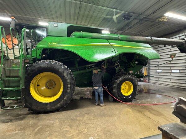 John Carnahan washes an S780 combine at Carnahan & Sons family farm in Knox County, Ind. (Courtesy of Dennis Carnahan)