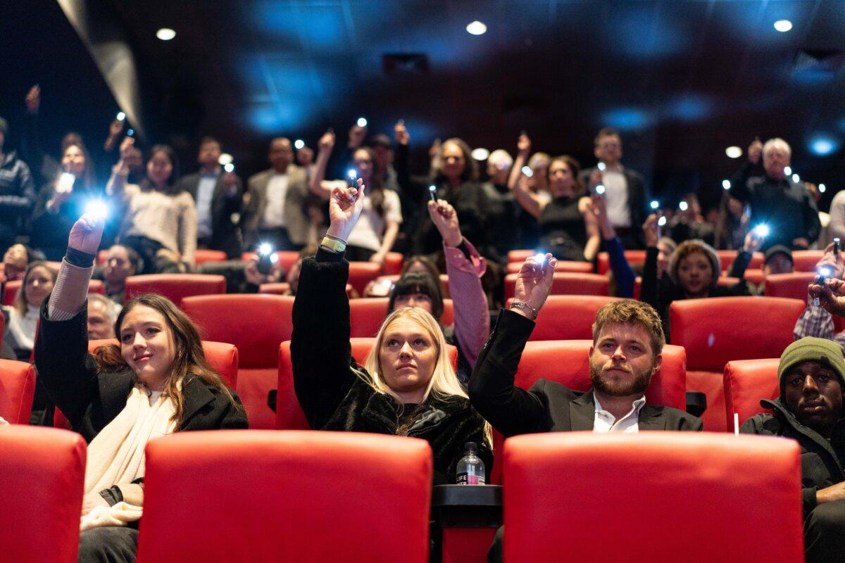 People light flashlights in memory of kratom victims after the screening of “Kratom: Side Effects May Include,” at the Regal Union Square theater, in New York City, on Jan. 18, 2026. (Samira Bouaou/The Epoch Times)