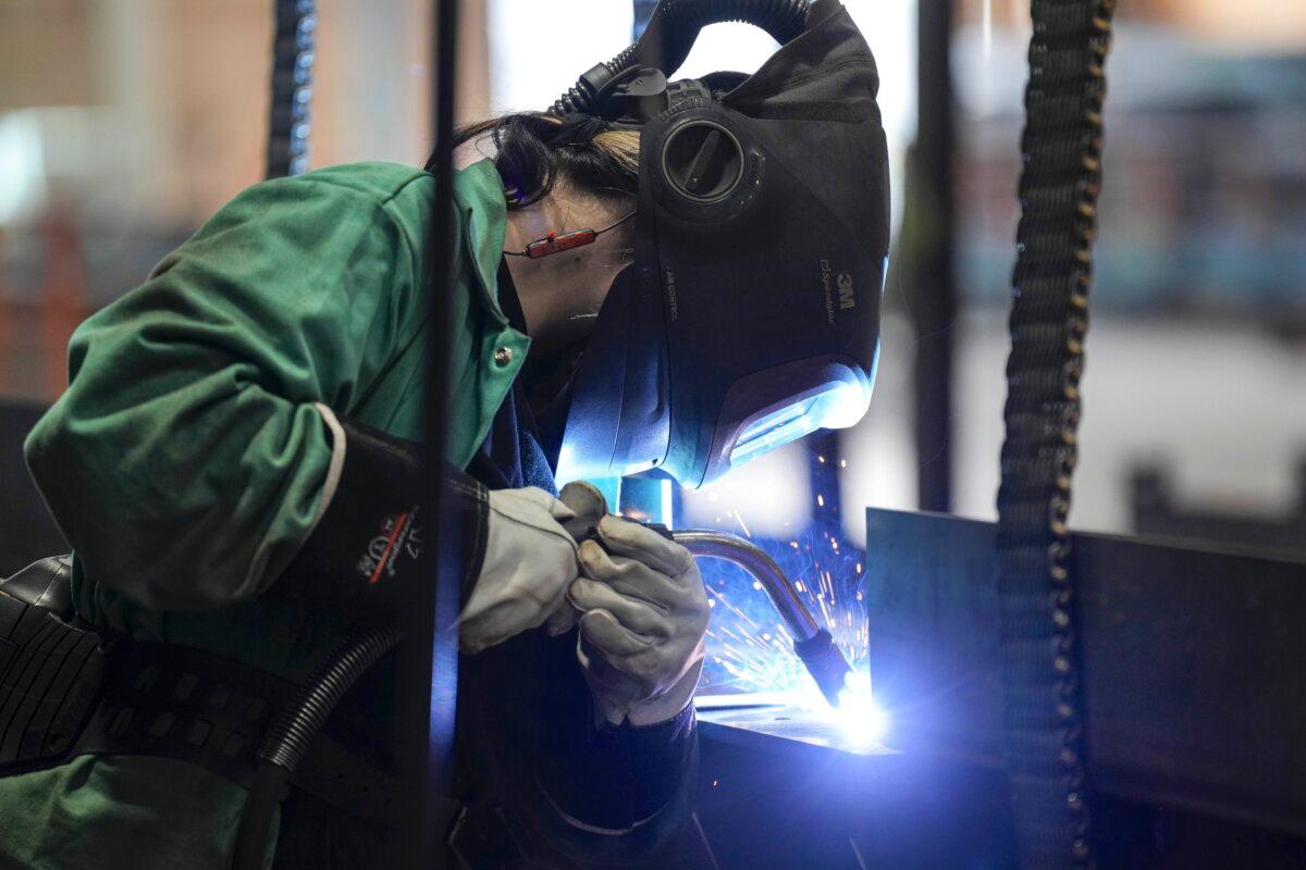 A welder works at a a steel manufacturing facility in Hamilton, Ont., on  July 16, 2025. (The Canadian Press/Chris Young)