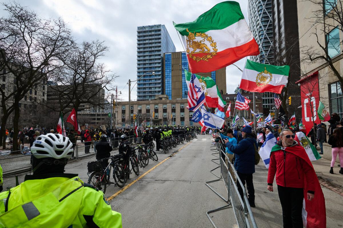 Protesters and counter-protesters demonstrate during an Al-Quds Day rally outside the U.S. Consulate in downtown Toronto on March 14, 2026. (The Canadian Press/Sammy Kogan)