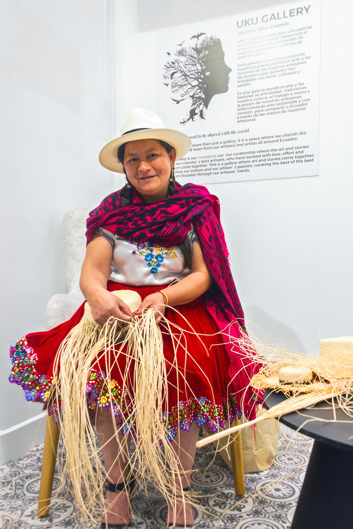 Olga Guznay weaves a toquilla straw hat in a small gallery near the Illa Experience Hotel. (Maria Coulson)