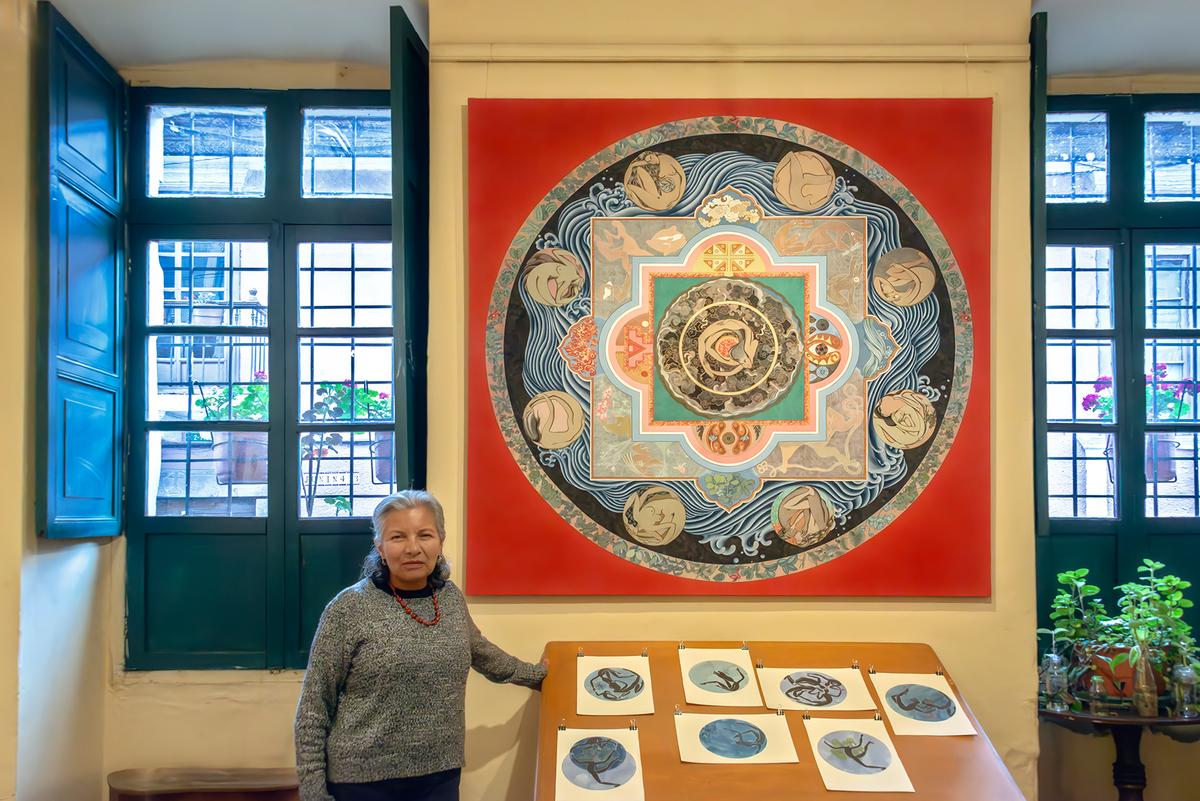 Sonia Rosales stands before one of her paintings in her San Marcos neighborhood home that also serves as her art studio. (Maria Coulson)