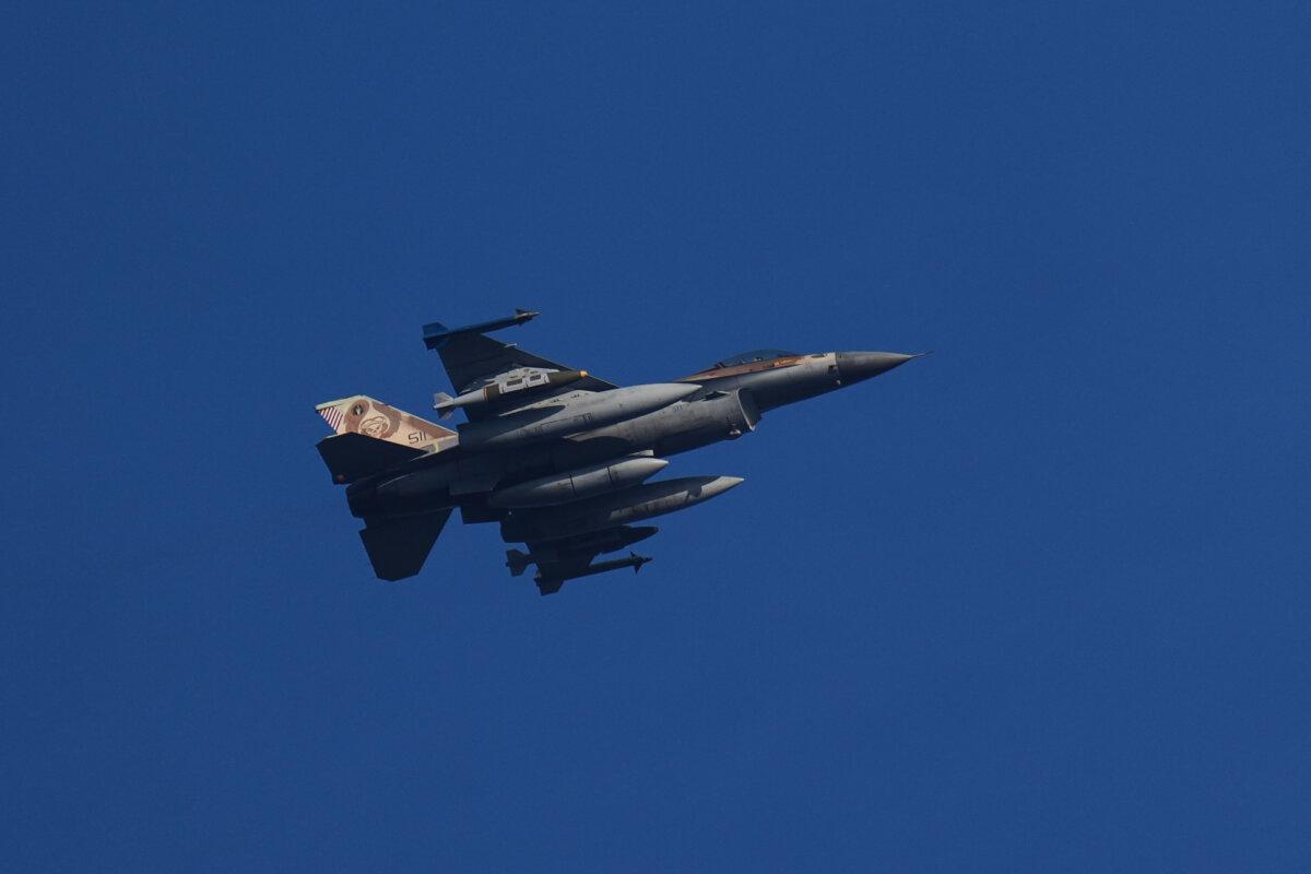 An armed Israeli fighter jet flies over northern Israel on March 13, 2026. (Ariel Schalit/AP Photo)