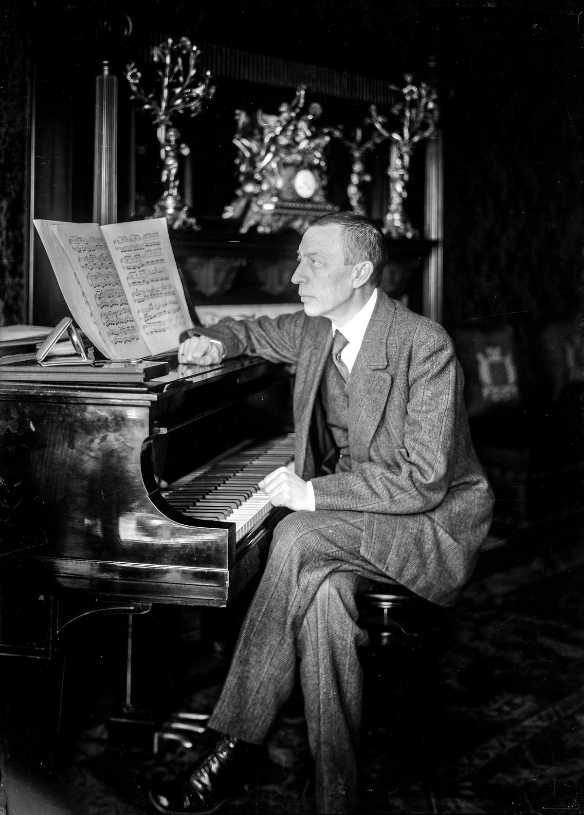 Sergei Rachmaninoff seated at a piano circa 1915–1920. Library of Congress. (Public Domain)