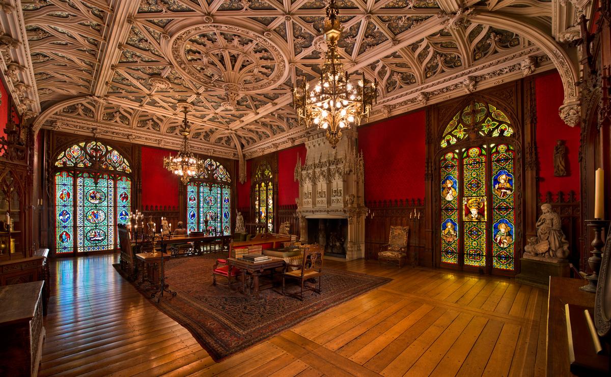 The Gothic Room features a groin vault ceiling, paneled wainscoting, and filigree chandeliers, all reflecting the medieval and Renaissance collection that it was designed to display. Its limestone fireplace was modeled after one in the Jacques Coeur House in Bourges, France. The ornamental molding draws further inspiration from French Gothic interiors, although with a local twist—crabs and lobsters are woven into the foliage in homage to Rhode Island's seaside setting. (The Preservation Society of Newport County)