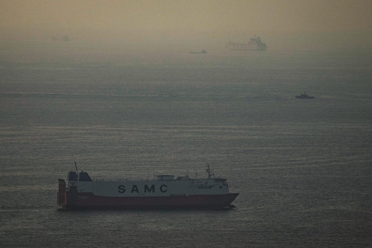 Cargo ships sail in the Arabian Gulf towards Strait of Hormuz in United Arab Emirates on March 19, 2026. (AP Photo)