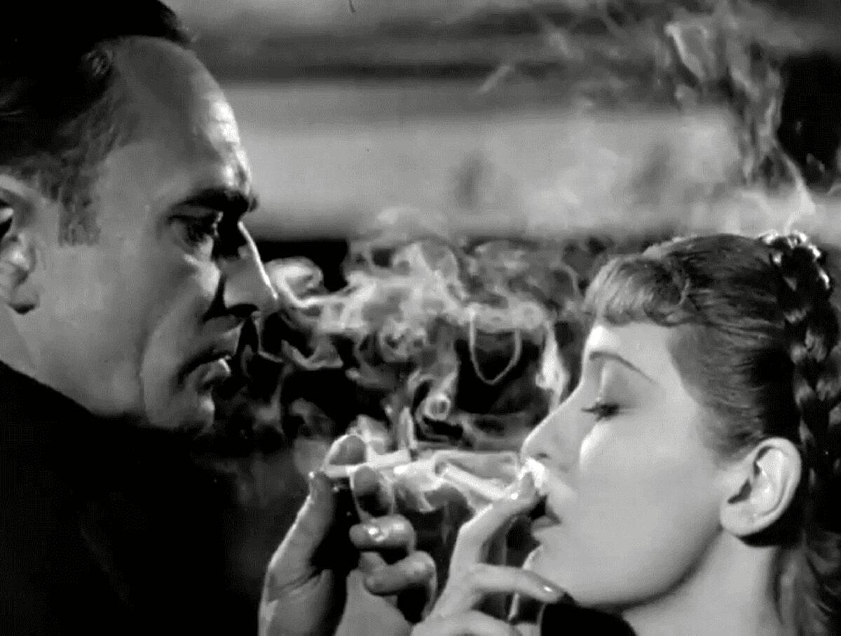 Capt. Ernst Hardt (Conrad Veidt) and Fraulein Tiel (Valerie Hobson) share a moment, in “U-Boat 29.” (London Films Productions)