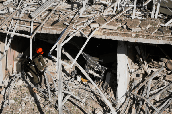 An Israeli rescue officer responds at the site of an Iranian missile strike in Tel Aviv, Israel, on March 24, 2026. (Ohad Zwigenberg/AP Photo)