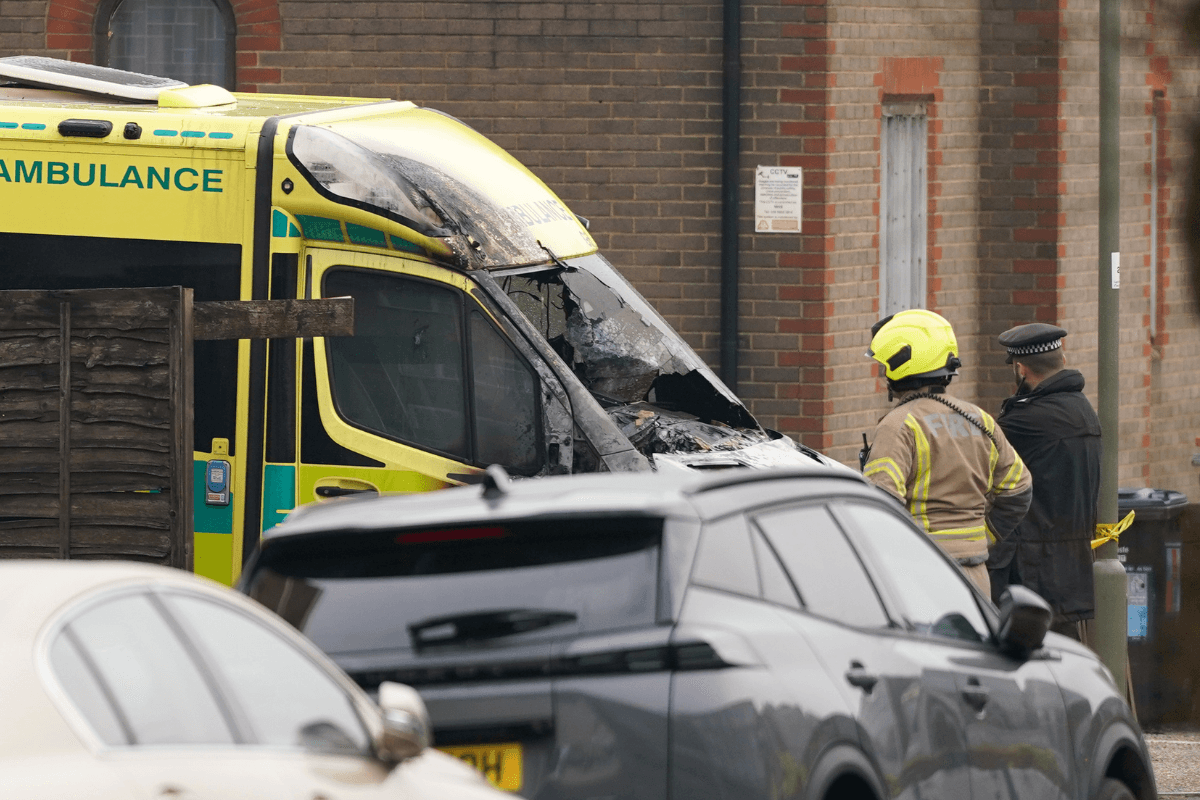 A firefighter and a police officer look at a burnt ambulance that was torched in an apparent anti-Semitic arson attack on four vehicles belonging to a Jewish Ambulance Service in Golders Green, London, on March 23, 2026. (Alberto Pezzali/AP Photo)