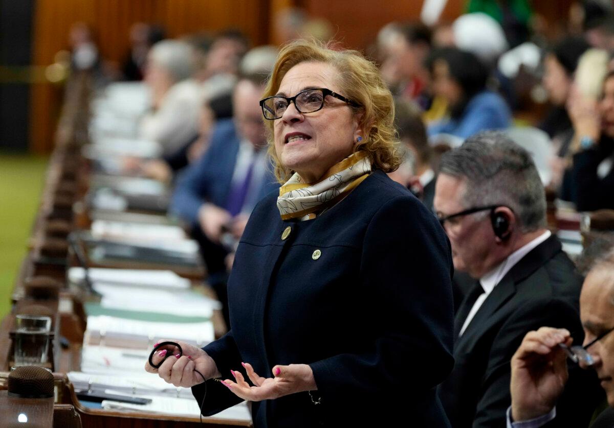 Minister of Immigration, Refugees, and Citizenship Lena Diab rises during question period in the House of Commons on Parliament Hill in Ottawa on Feb. 23, 2026. (The Canadian Press/Justin Tang)