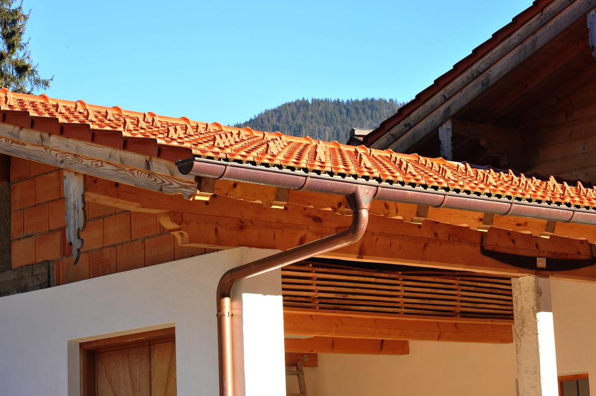 Gutters add to a home's function and appearance, giving it a finished look while managing roof runoff. (klikkipetra/Shutterstock)