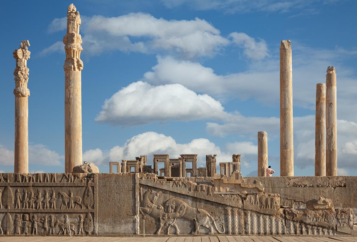 The Apadana Palace, where the king received nobility and emissaries, was the largest and most important ceremonial hall at Persepolis. Measuring over 10,000 square feet, the hall was originally supported by 72 stone columns, which stood nearly 80 feet tall. Today, only 14 columns remain intact. The eastern and northern staircases are adorned with bas-relief sculptures, illustrating delegates bringing gifts for the Persian Nowruz. (New Year) festival. (Borna_Mirahmadian/Shutterstock)