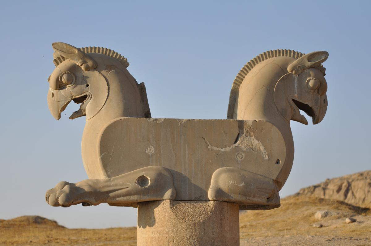 Palace halls featured columns topped by double-headed bull, lion, or "Huma bird" capitals. The Huma, also called Homa, is a mythological Persian bird similar to a Phoenix. The double-headed Huma capital at Persepolis is represented as similar to a griffin with lion feet. (Milonk/Shutterstock)