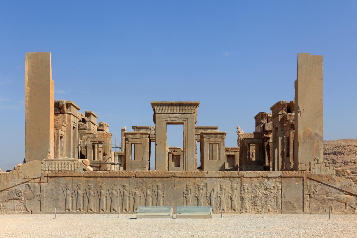 The Palace of Darius (also known as the Tachara or Winter Palace) was the first palace built at Persepolis, and it served as the private residence of Darius I. The southern façade features a double-reversed stairway that connects the main hall to the south court. The carved bas-reliefs depict royal guards, tribute bearers, and mythical creatures. The palace featured a rectangular layout (131 feet by 98 feet) with a 12-columned central hall and porticoes, or covered walkways. (Massimo Pizzotti/Shutterstock)