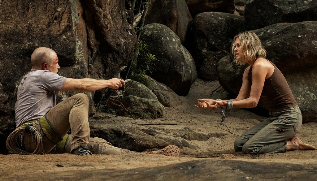 Ben (Taron Egerton) faces Sasha (Charlize Theron), in "Apex." (Kane Skennar/Netflix)