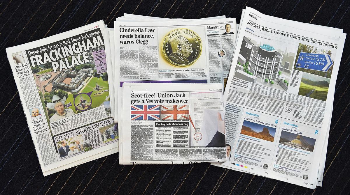 London newspapers ran an April Fools' Day gag on April 1, 2014, claiming that Scotland had gained independence and would replace the queen's head on coins and bring in U.N. peacekeepers wearing purple berets. (BEN STANSALL/AFP/Getty Images)