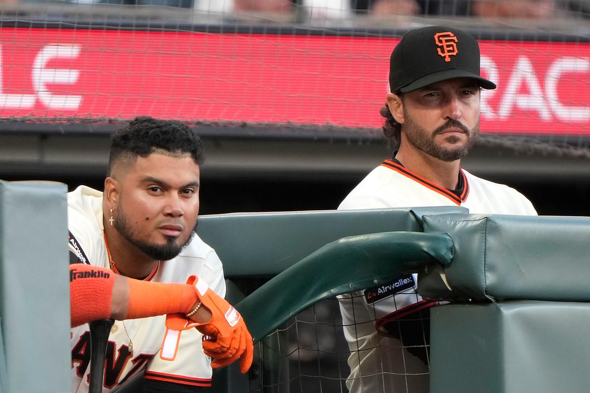Luis Arraez (L) and manager Tony Vitello of the San Francisco Giants look on against the New York Yankees during the fifth inning on Opening Day at Oracle Park in San Francisco on March 25, 2026. (Thearon W. Henderson/Getty Images)