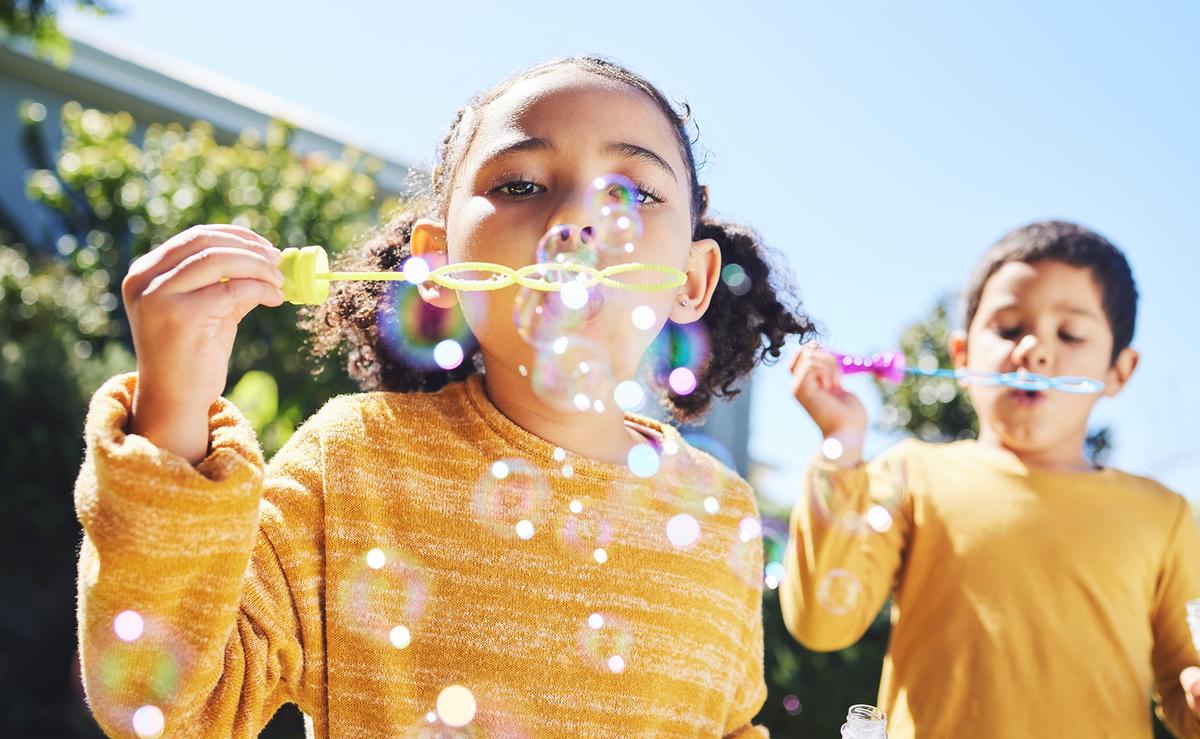 Children experience life in the present moment, using play and imagination to explore the world. (PeopleImages/Shutterstock)