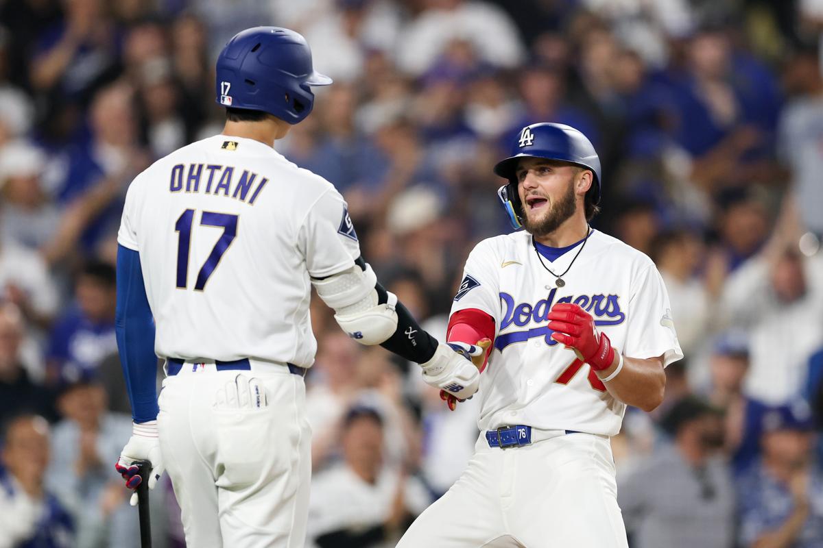 Shohei Ohtani #17 and Alex Freeland #76 of the Los Angeles Dodgers celebrate after Freeland's one run home run against the Arizona Diamondbacks during the third inning of a game at Dodger Stadium in Los Angeles on March 27, 2026. (Luke Hales/Getty Images)