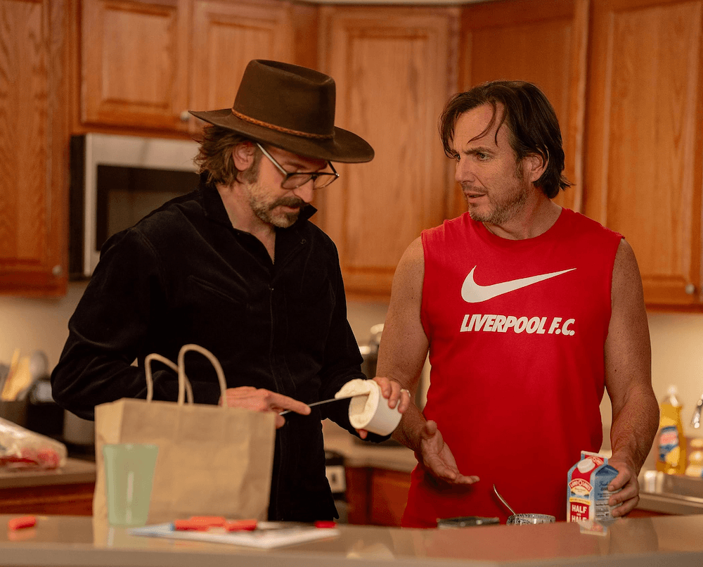 Balls (Bradley Cooper) and Alex (Will Arnett), in "Is This Thing On?" (Jason McDonald/Searchlight Pictures)