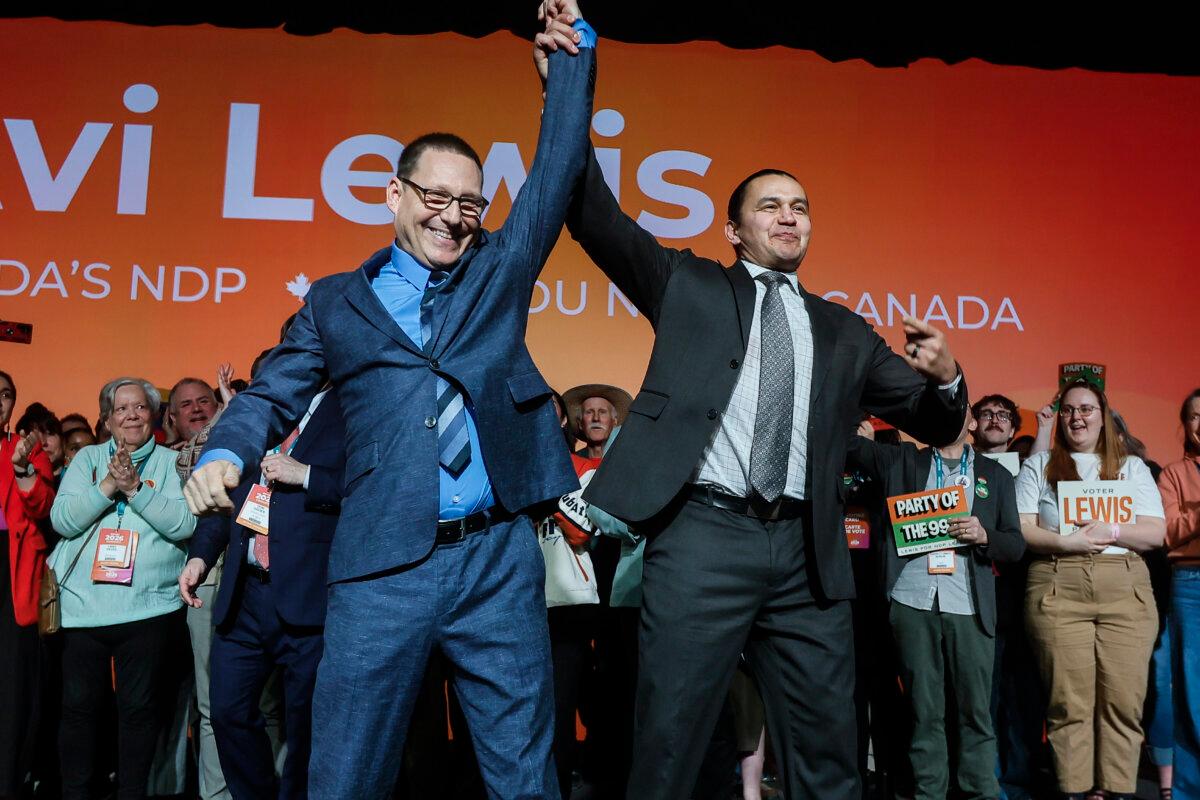 Newly elected federal NDP Leader Avi Lewis (L) celebrates with Manitoba Premier Wab Kinew at the NDP's convention in Winnipeg on March 29, 2026. (The Canadian Press/John Woods)