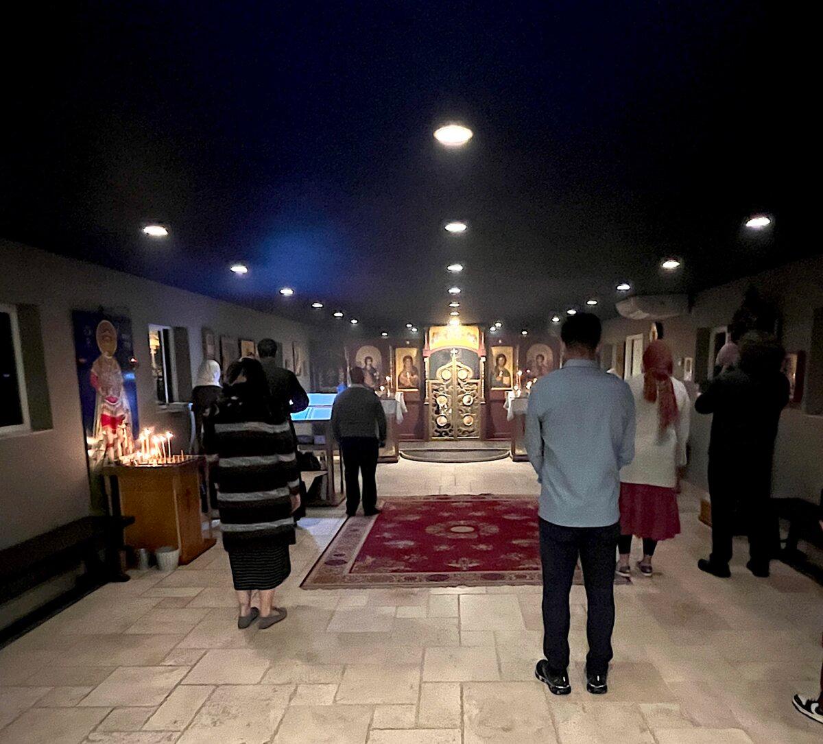 Parishioners gather during an evening service at Holy Archangels Orthodox Church in Phoenix on Jan. 30, 2026. (Allan Stein/The Epoch Times)