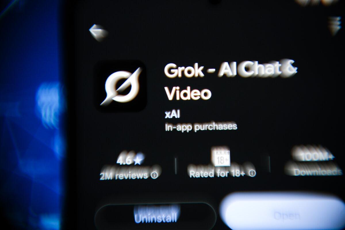 The screen shows the Grok app in this photo illustration. (Oleksii Pydsosonnii/The Epoch Times)