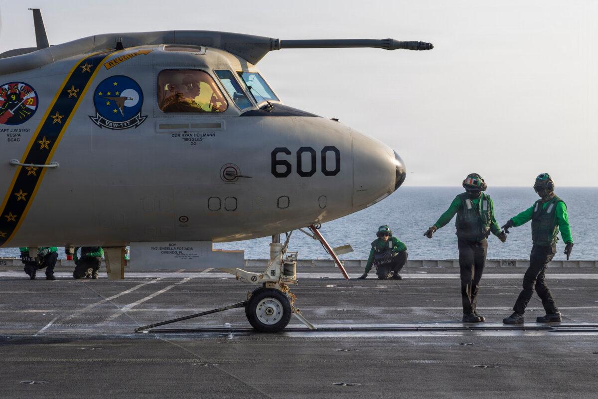 U.S. Sailors prepare to launch an E-2D Hawkeye, attached to Airborne Command & Control Squadron (VAW) 117, on the flight deck of Nimitz-class aircraft carrier USS Abraham Lincoln (CVN 72) during Operation Epic Fury, March. 14, 2026. (Courtesy of the U.S. Navy)