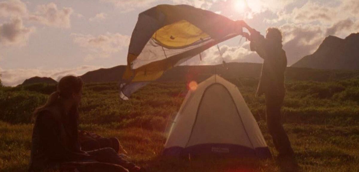 Mackenzie (Ella Purnell) watches Rene Bartlett (Bruce Greenwood) as he sets up a tent, in “Wildlike.” (GJW+)